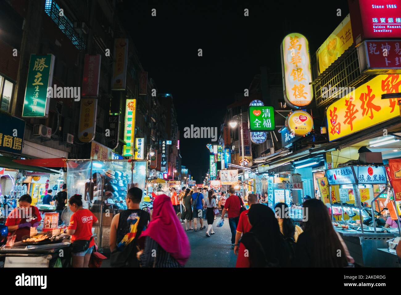 The Guangzhou Street Night Market alive at night in Taipei, Taiwan Stock Photo