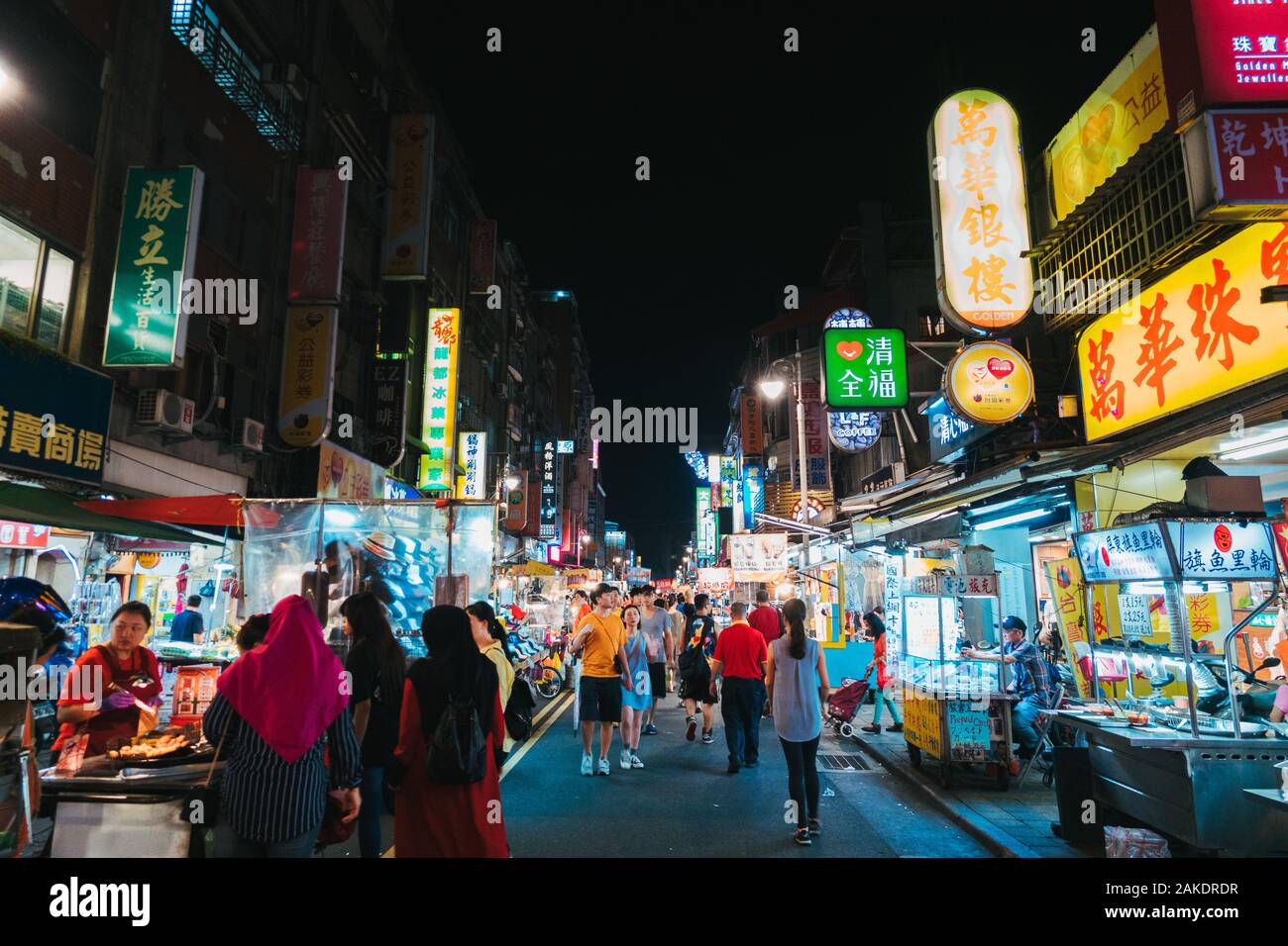 The Guangzhou Street Night Market alive at night in Taipei, Taiwan Stock Photo