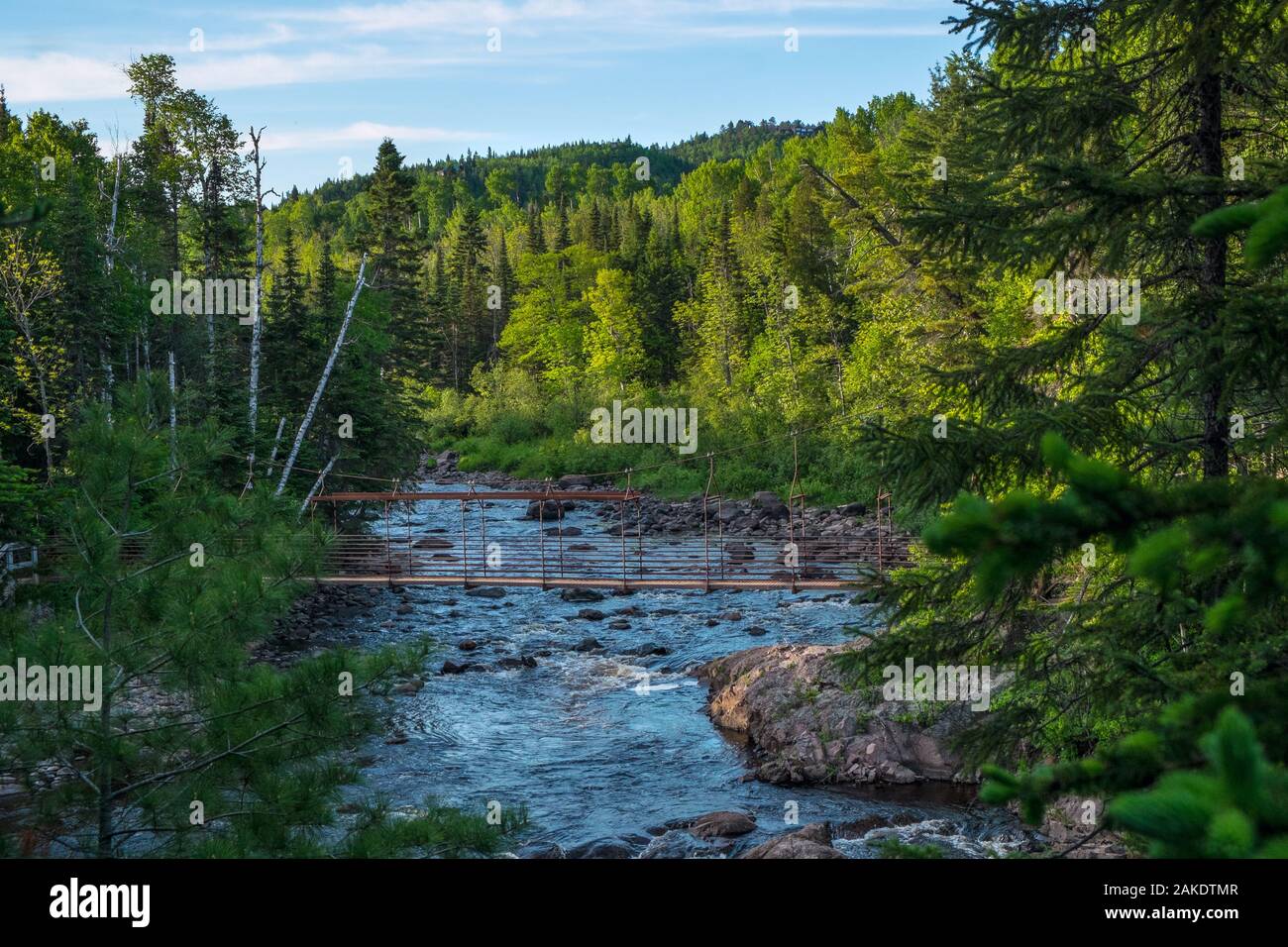 Footbridge and rapids on the Baptism River, northern Minnesota, USA Stock Photo