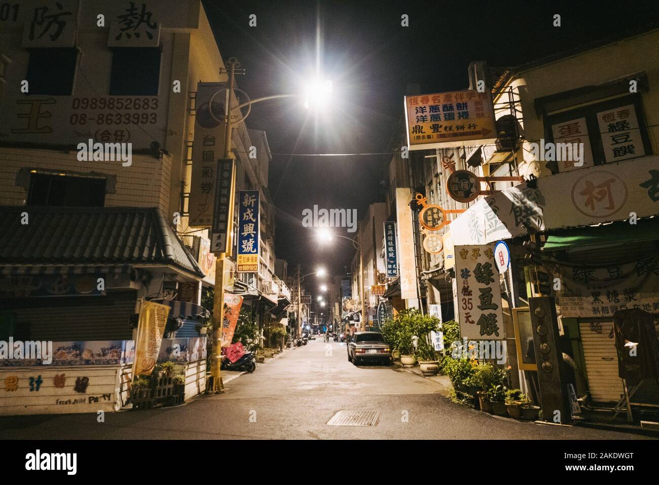 An empty but well-lit alleyway at night in Hengchun Township, Taiwan Stock Photo