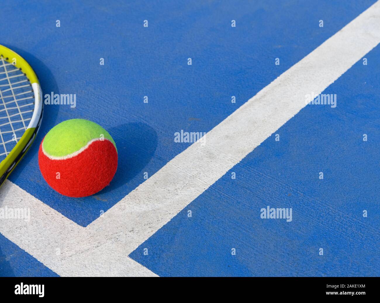 tennis ball and racket in an outdoor court with copy space Stock Photo ...