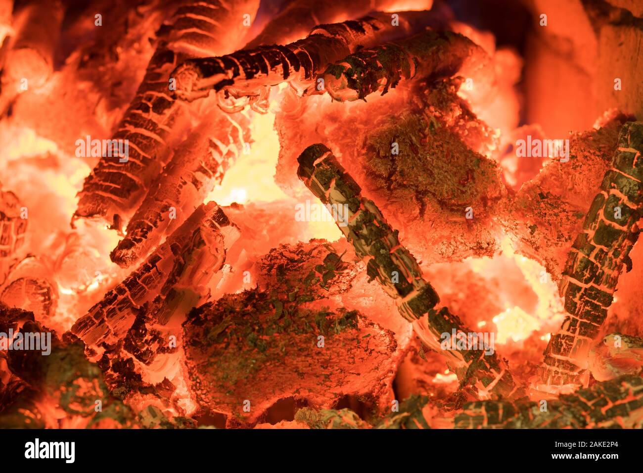 Burning firewood in the fireplace close up, BBQ fire, charcoal