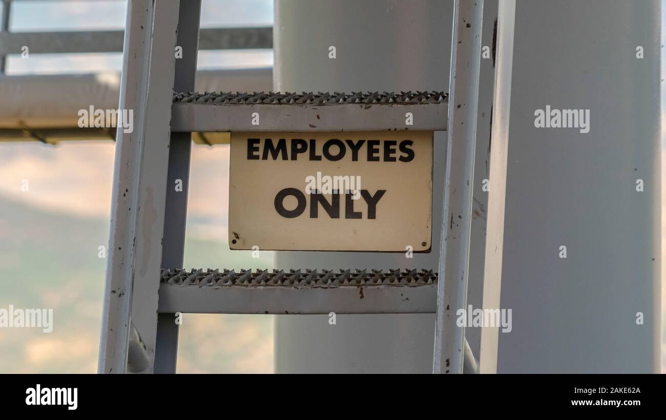 Panorama Park City Utah in summer with Employees Only sign and ladder under chairlifts Stock Photo