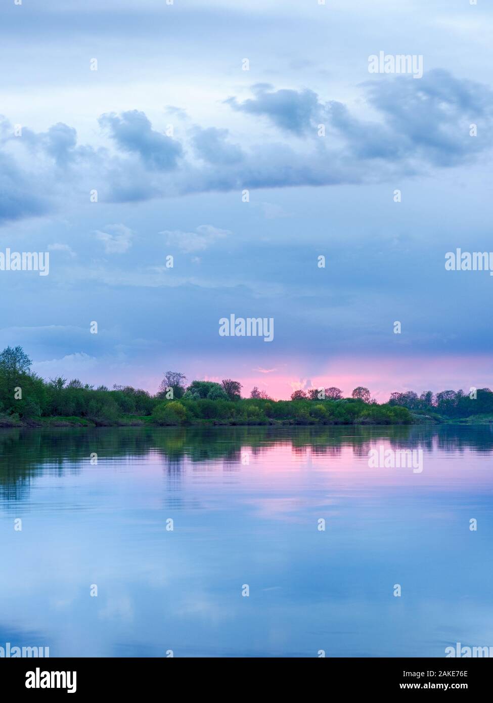 Colorful sunset in the river with reflex Stock Photo - Alamy