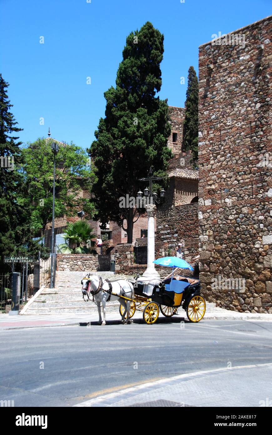 Horse drawn carriage outside entrance to the Malaga castle, Malaga, Malaga Province, Andalucia, Spain, Western Europe. Stock Photo