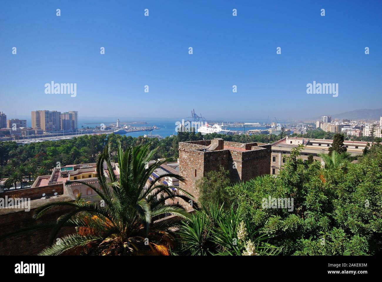 Elevated harbour view with the castle walls in the foreground, Malaga, Malaga Province, Andalucia, Spain, Western Europe. Stock Photo