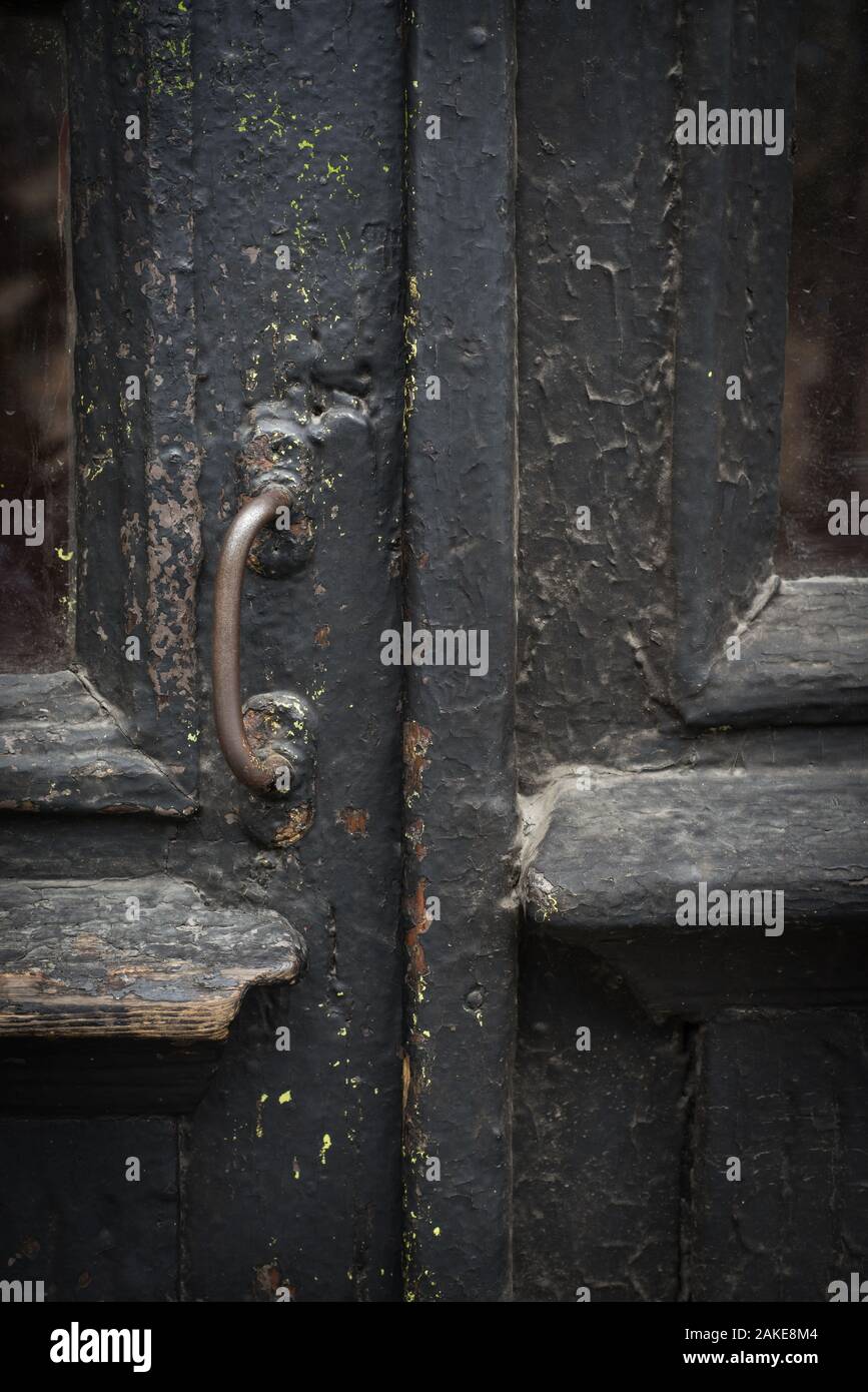 Antique vintage black wooden door close up Stock Photo