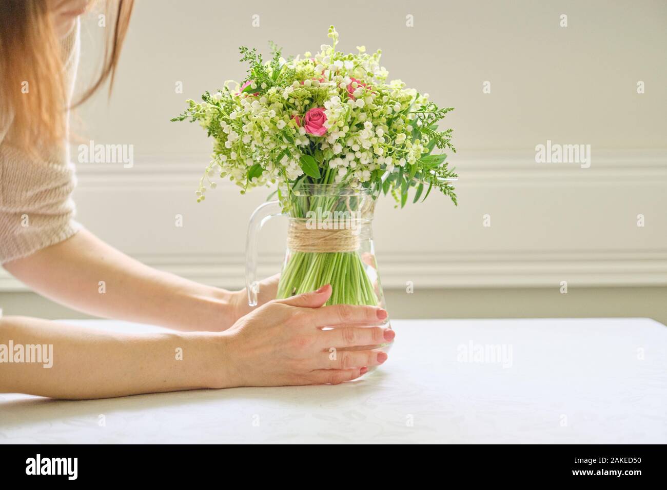 Female hand placing flowers hires stock photography and images Alamy