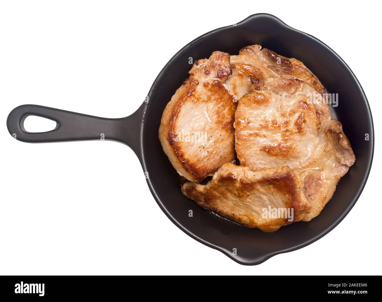 Fried pork meat in a pan isolated on white background Stock Photo - Alamy
