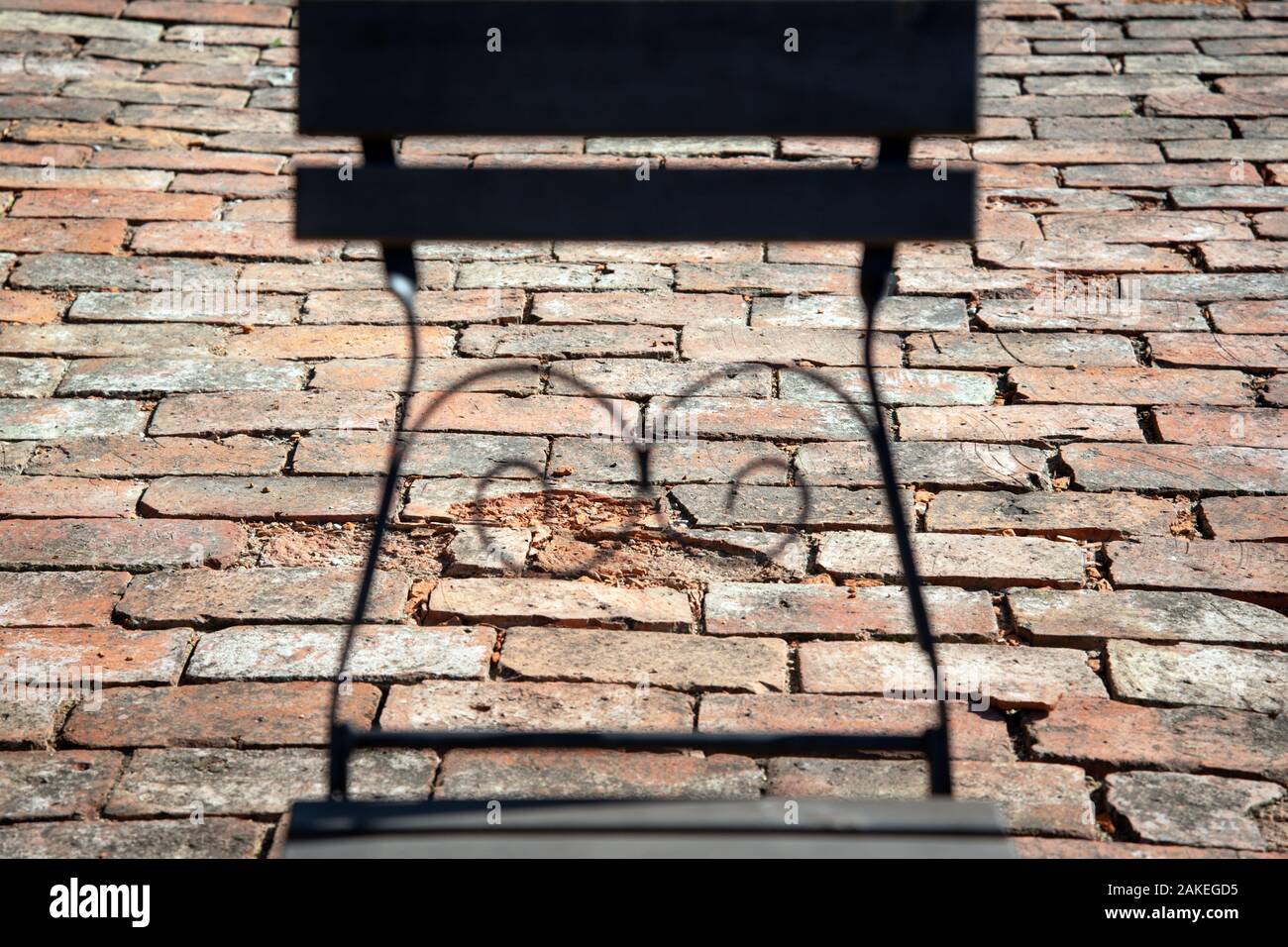 Brick surface with abstract unfocus silhouette of chair. Stock Photo
