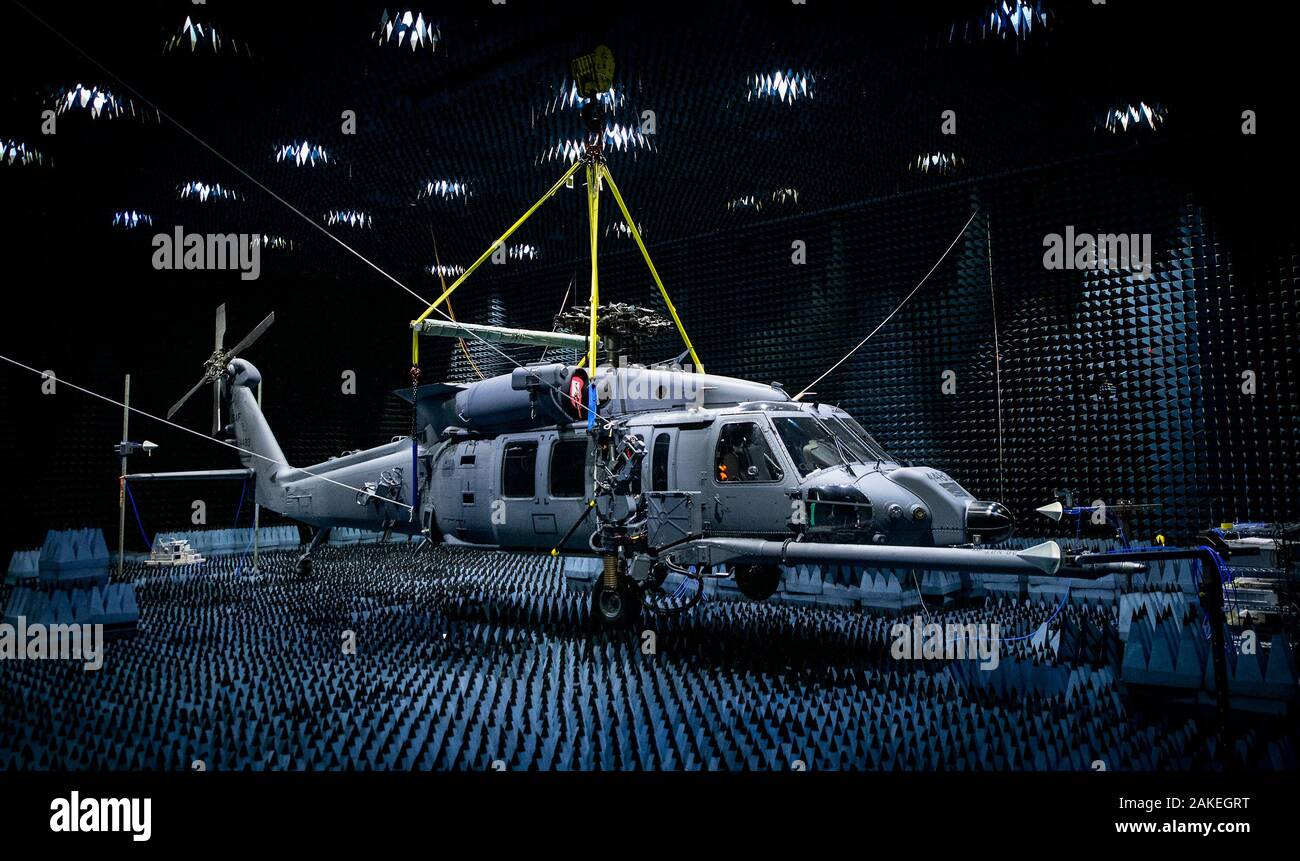 A 413th Flight Test Squadron HH-60W hangs in the anechoic chamber at the Joint Preflight Integration of Munitions and Electronic Systems hangar Jan. 6 at Eglin Air Force Base, Fla. The Whiskey entered the chamber for approximately seven weeks of defensive systems testing. The J-PRIMES anechoic chamber is a room designed to stop internal reflections of electromagnetic waves, as well as insulate from exterior sources of electromagnetic noise. J-PRIMES provides this environment to facilitate testing air-to-air and air-to-surface munitions and electronics systems on full-scale aircraft and land ve Stock Photo