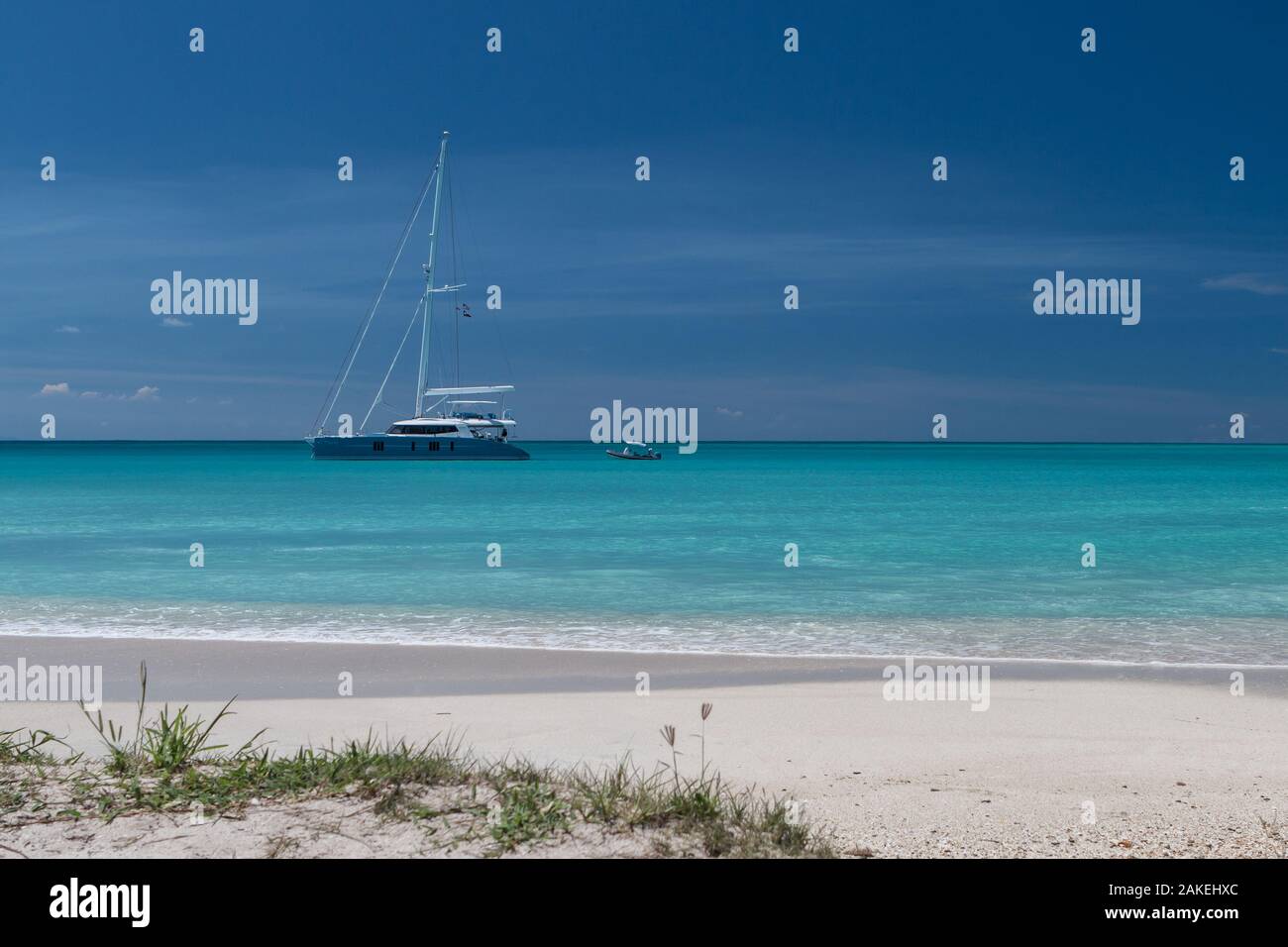 Beautiful yacht on deep blue sea and sky just off Coco Beach in Antigua, Caribbean Stock Photo