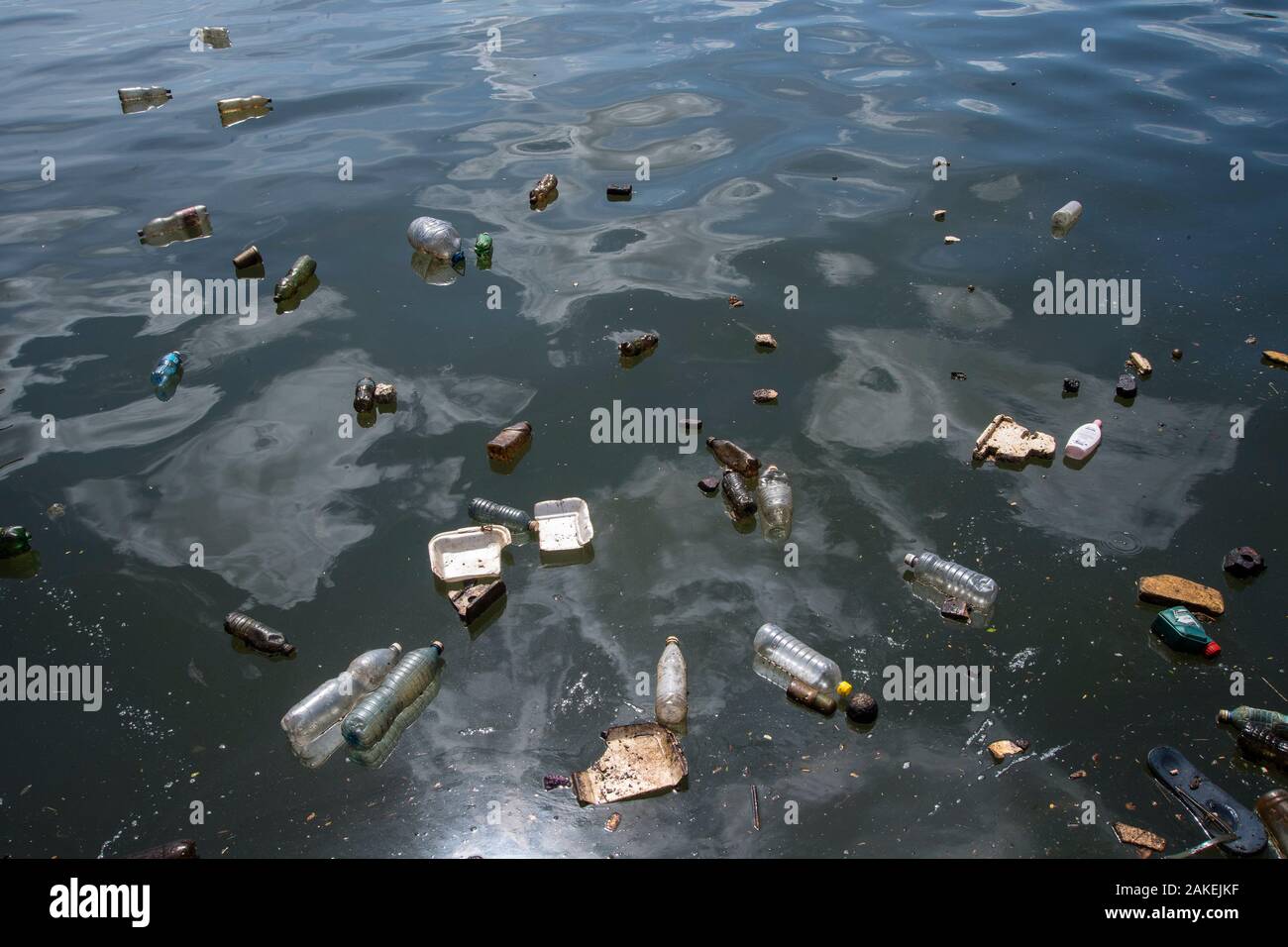 Plastic pollution floating on the surface of the water in the harbour of Havana, Cuba. Stock Photo