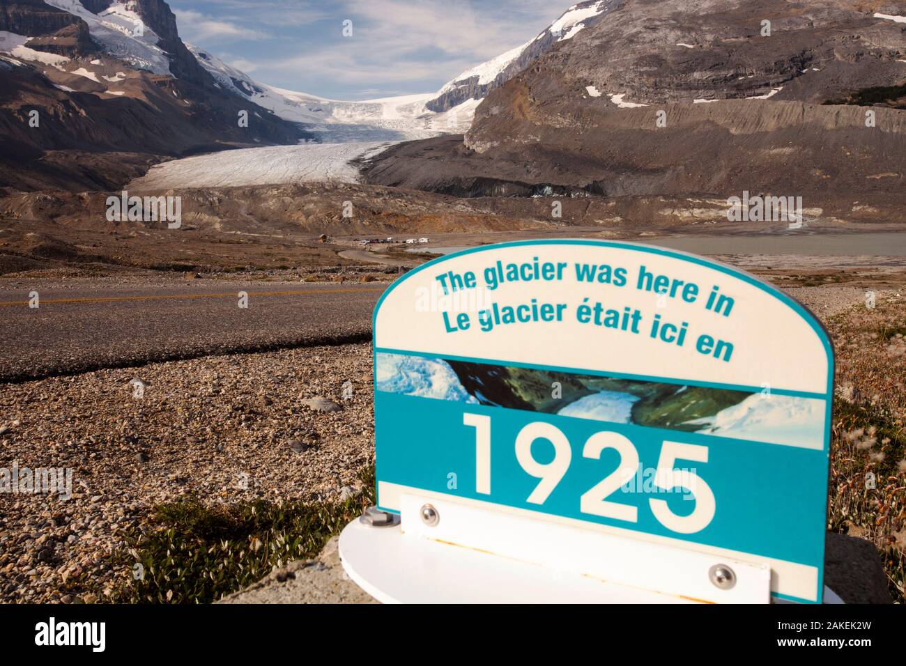 Sign marking the former extent of the Athabasca glacier, in 1925. The glacier has lost 60 percent of its ice in the last 150 years. Rocky Mountains, Alberta, Canada. August 2012. Stock Photo