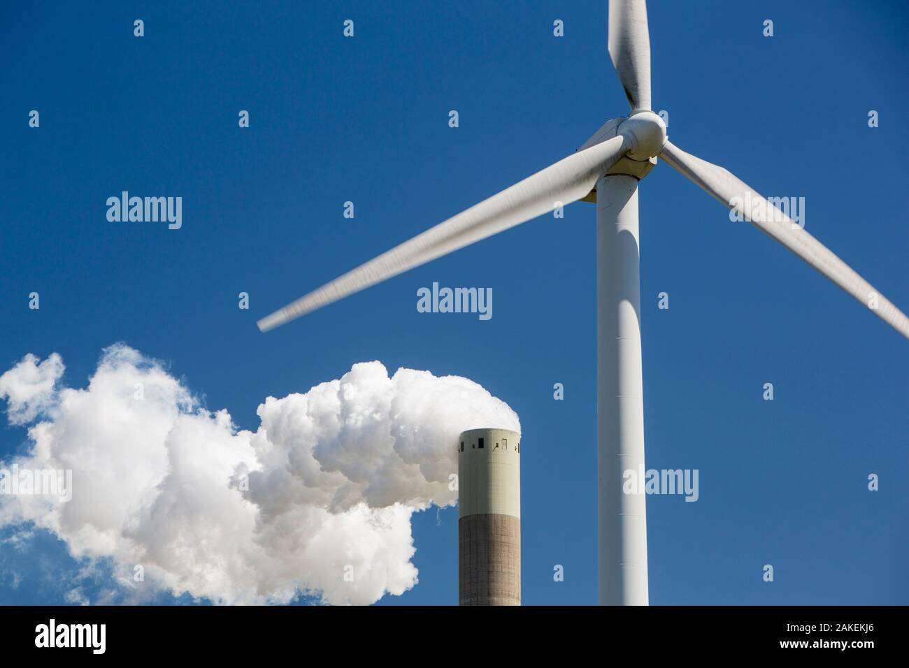 Wind turbine with stacks of coal fired power station in Amsterdam, Netherlands. May 2013 Stock Photo