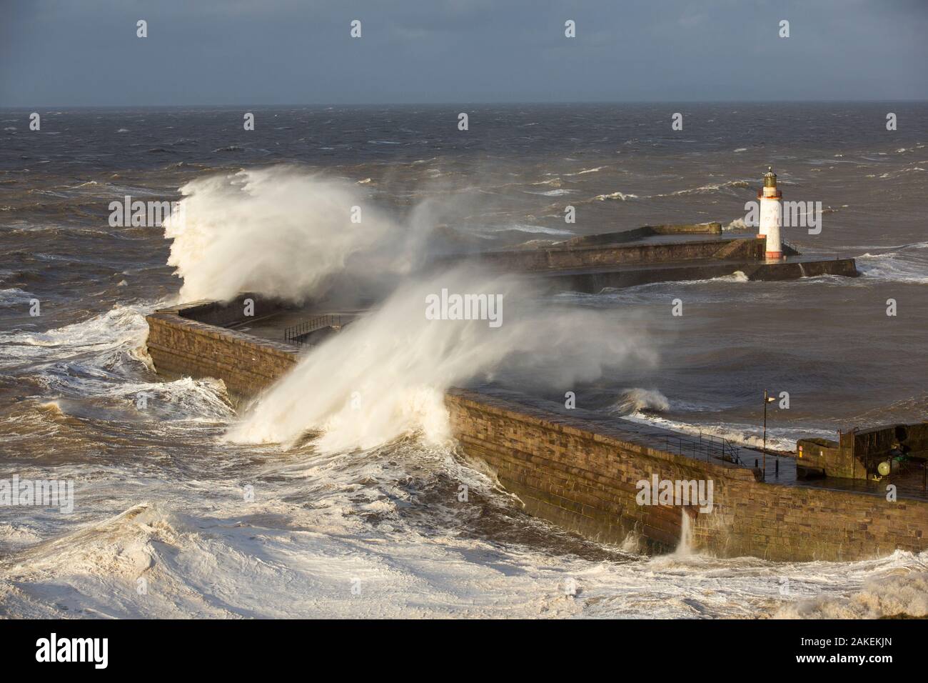 Storm waves from an extreme low pressure system batter Whitehaven harbour, Cumbria, UK, December 2014. Stock Photo