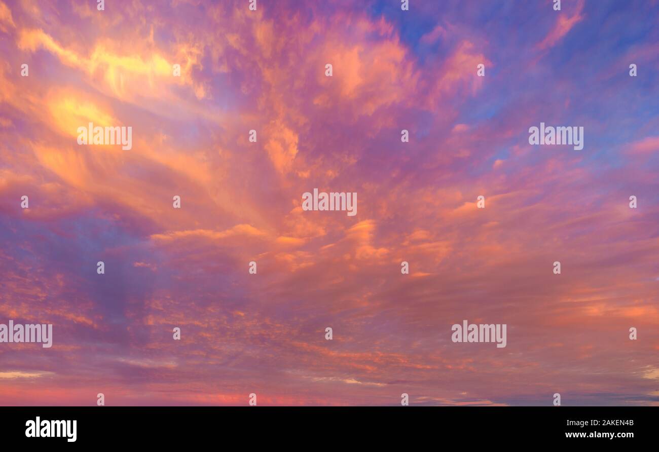 beautifully lit clouds during sunrise Stock Photo
