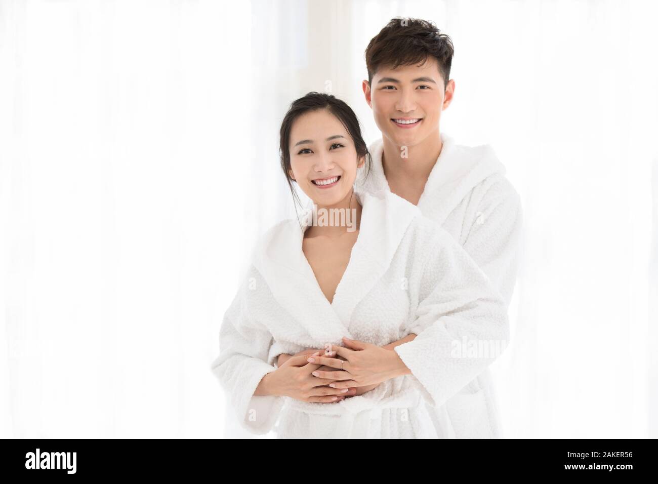 Happy young Chinese couple in bathrobe Stock Photo Alamy