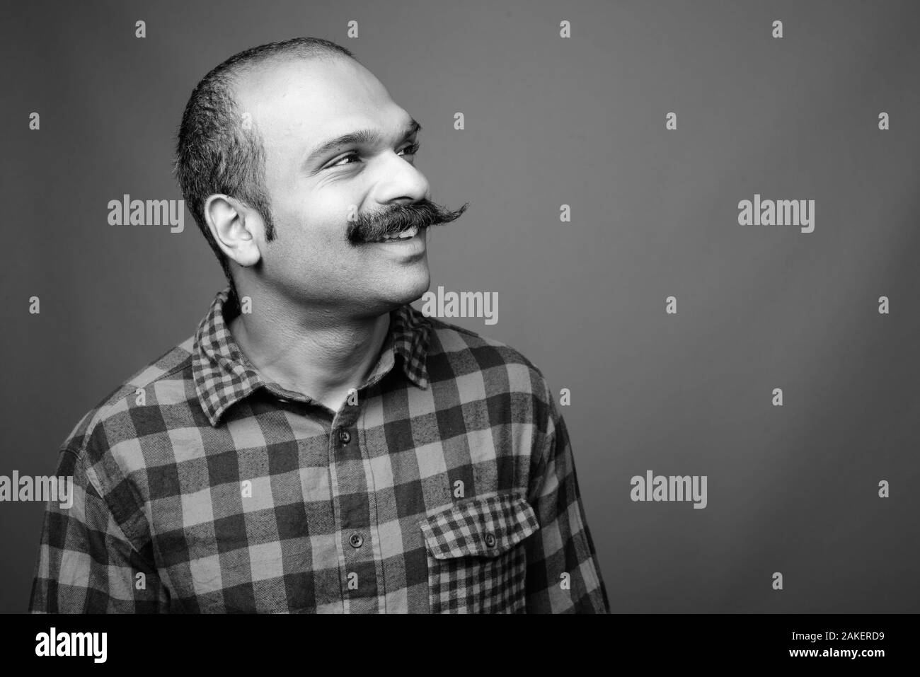 Smiling mid adult indian Black and White Stock Photos & Images - Alamy