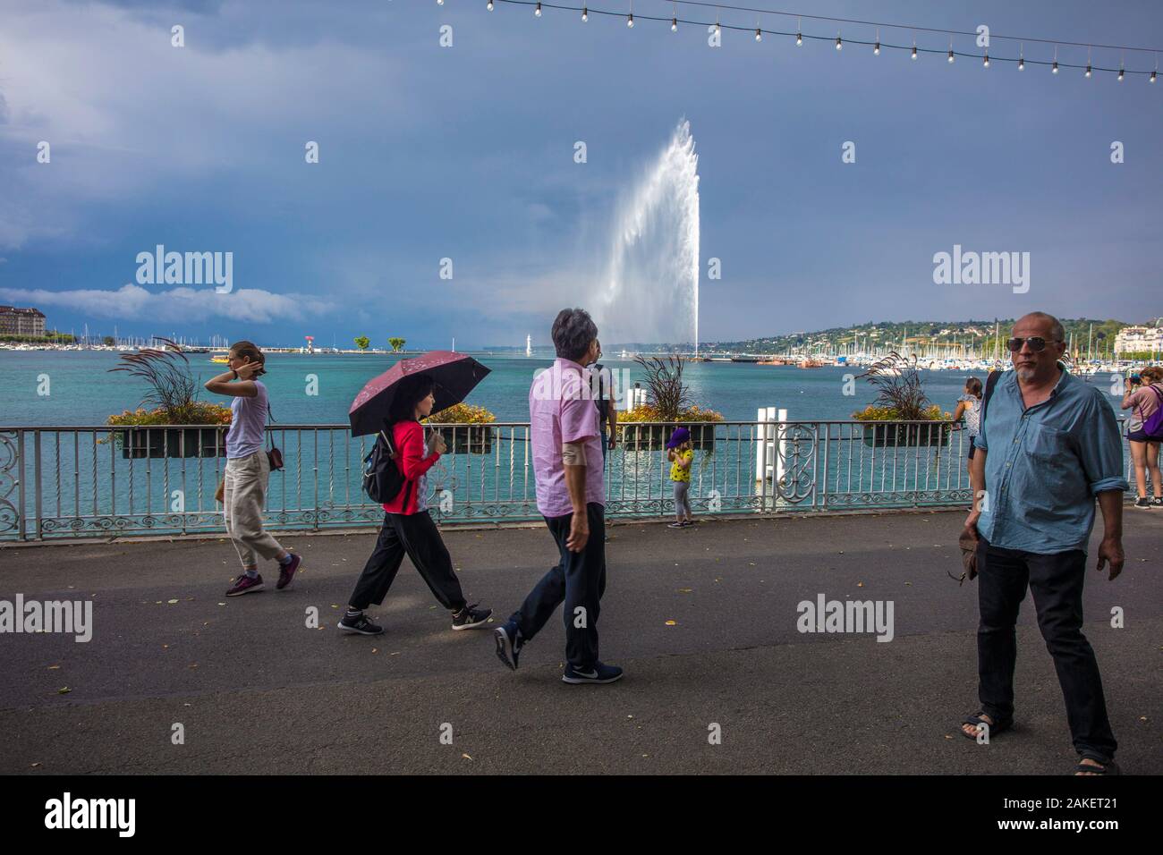 People walking on the Leman lakeside by the Jet d´Eau in Geneva. Switzerland Stock Photo