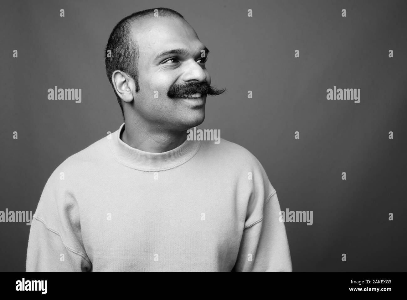 Smiling mid adult indian Black and White Stock Photos & Images - Alamy