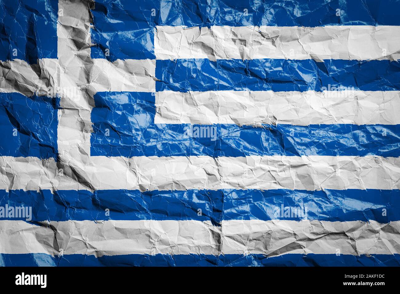 National flag of Greece on crumpled paper. Flag printed on a sheet. Flag image for design on flyers, advertising. Stock Photo