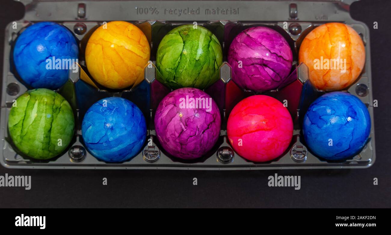 Plastic bowl full of colourful Easter eggs Stock Photo