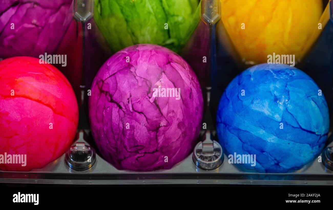 Pink Easter egg in the middle of other Easter eggs Stock Photo