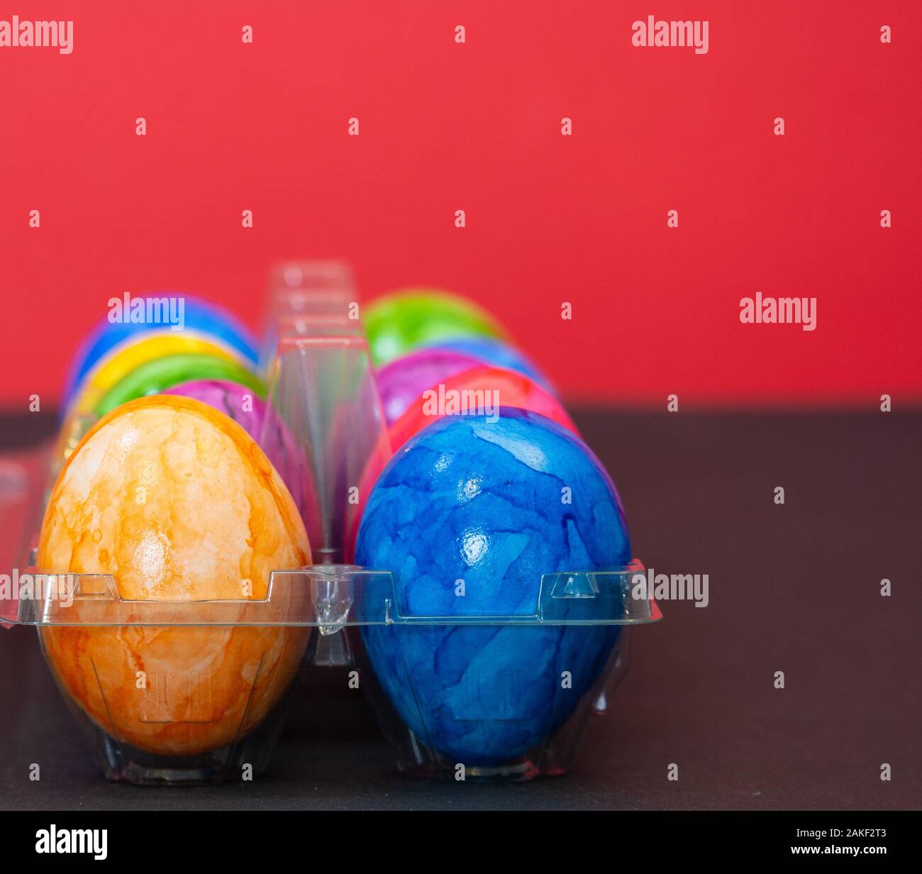Plastic bowl full of colourful Easter eggs Stock Photo