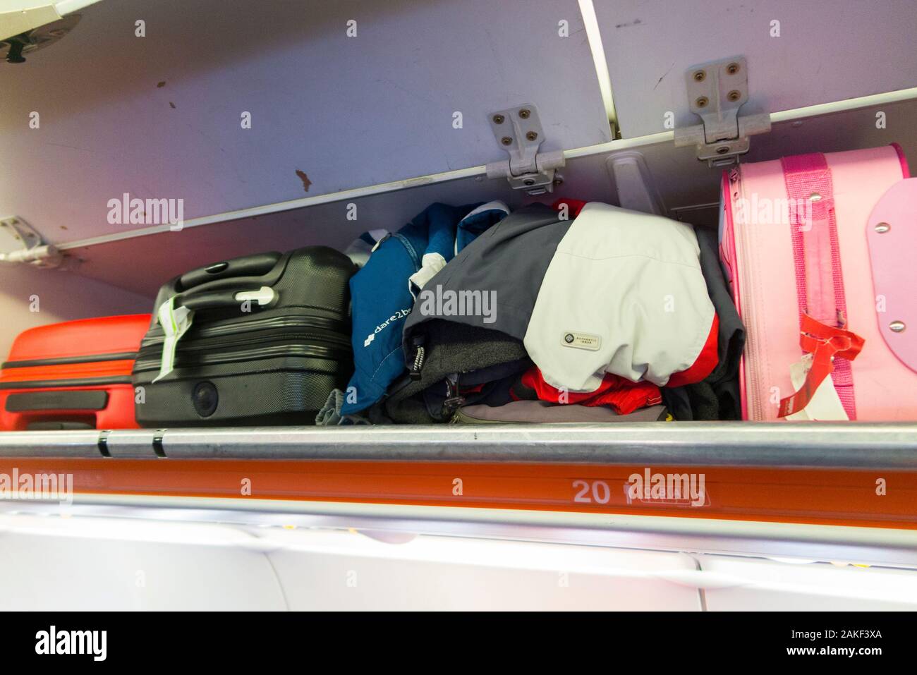 Overhead passenger locker / lockers / compartment / compartments for stowing passengers bags cabin luggage on an Easyjet Airbus A320 or  A319 plane. (105) Stock Photo