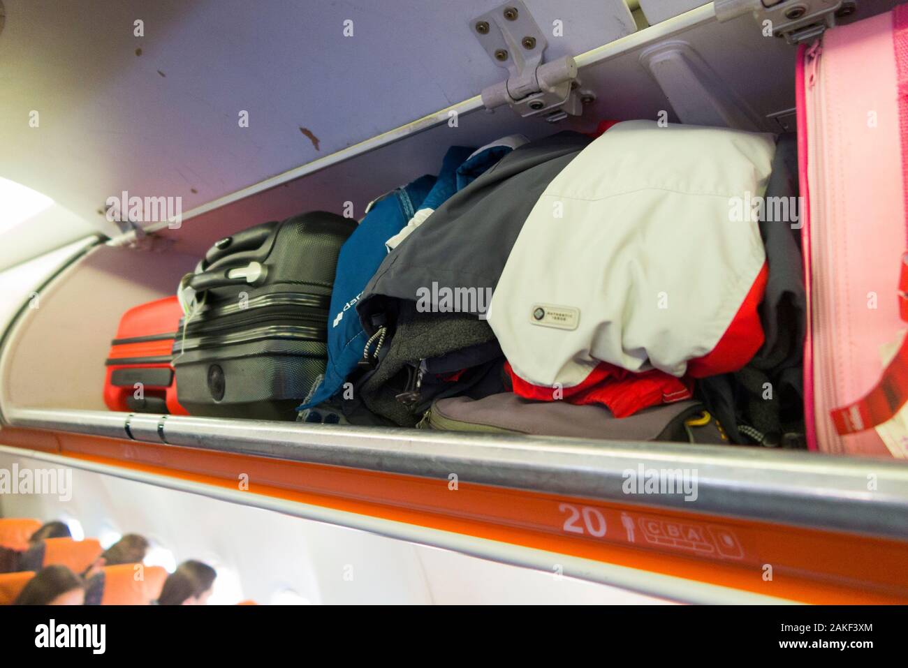 Overhead passenger locker / lockers / compartment / compartments for stowing passengers bags cabin luggage on an Easyjet Airbus A320 or  A319 plane. (105) Stock Photo