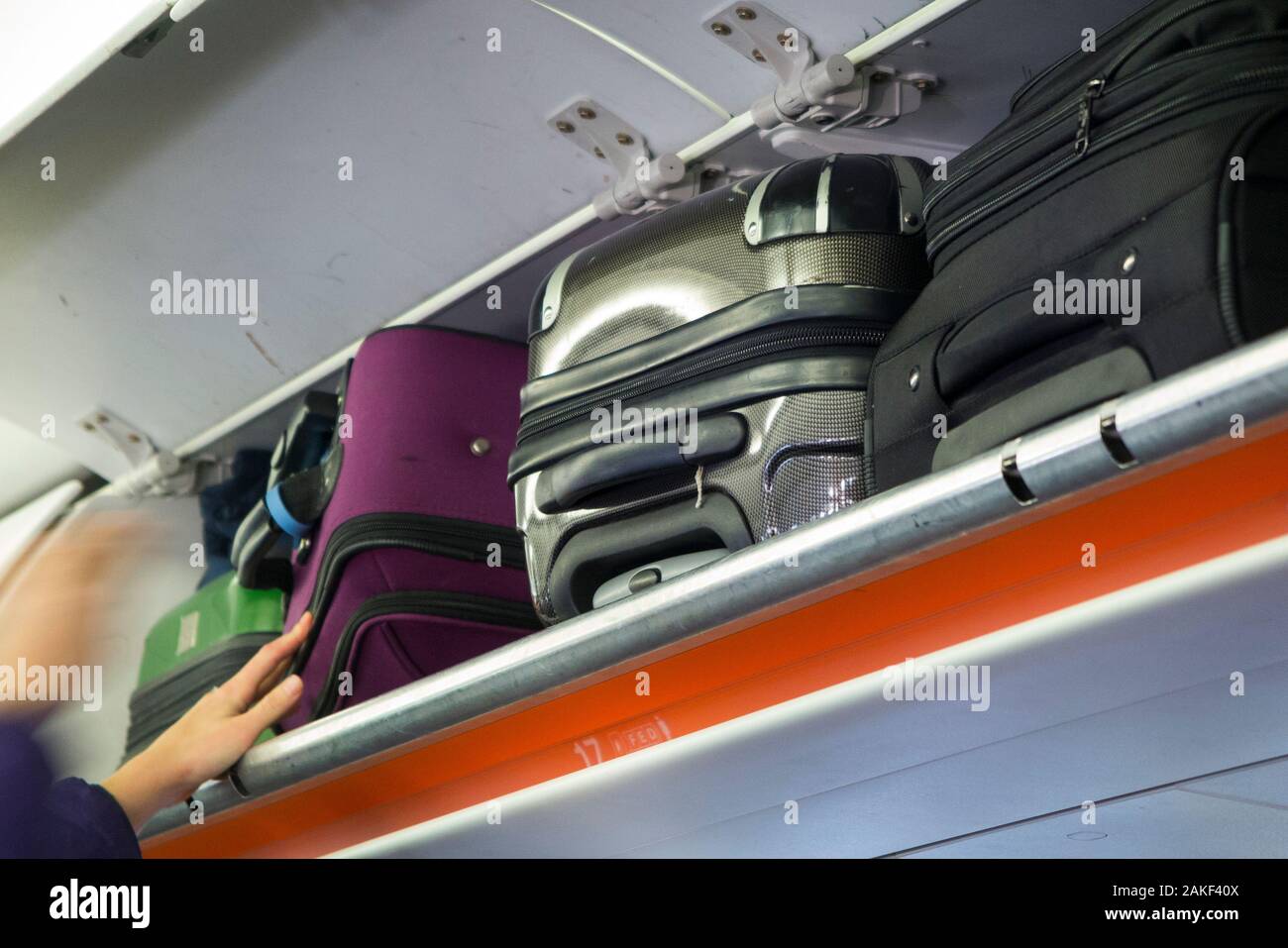 Overhead passenger locker / lockers / compartment / compartments for stowing passengers bags cabin luggage on an Easyjet Airbus A320 or  A319 plane. (105) Stock Photo