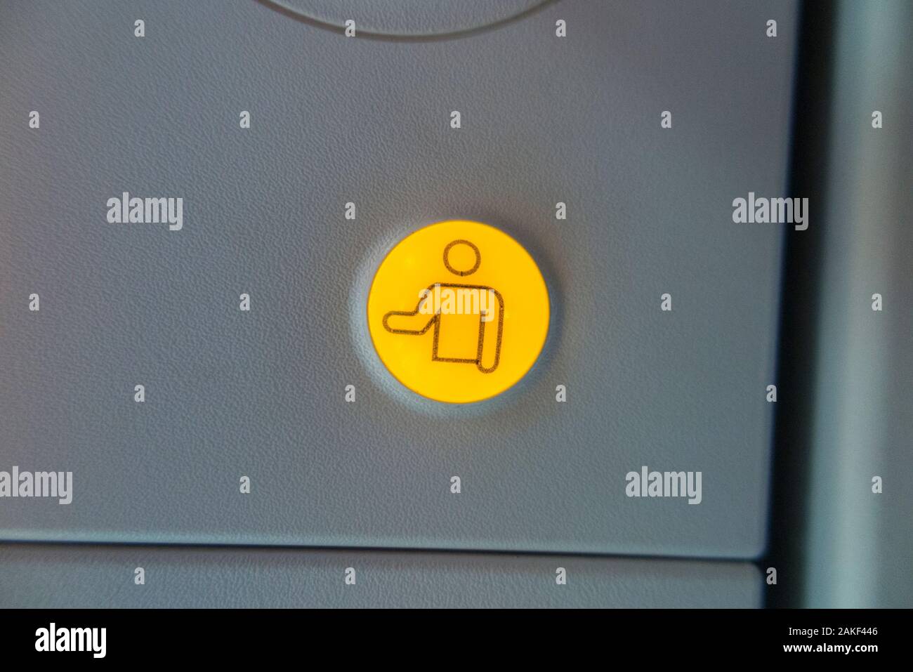 Button to call the flight attendants above passenger / passengers seat