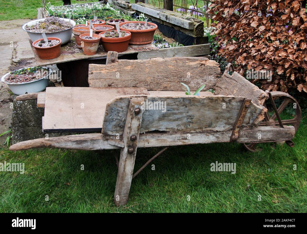 Rustic old wooden wheelbarrow Stock Photo