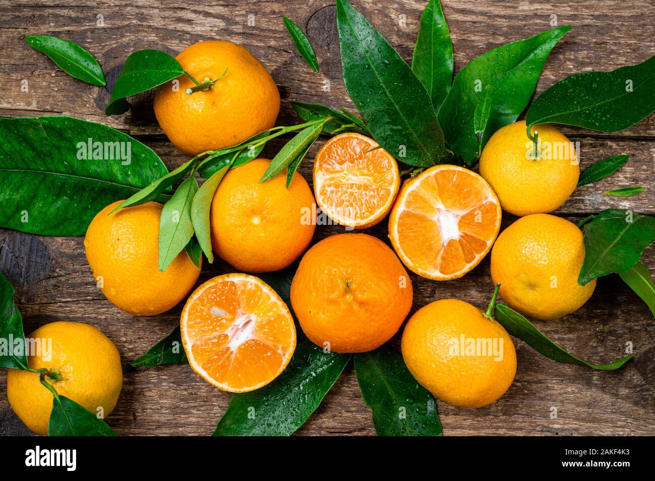 Tangerine mandarines clementine orange fruits with leaves on