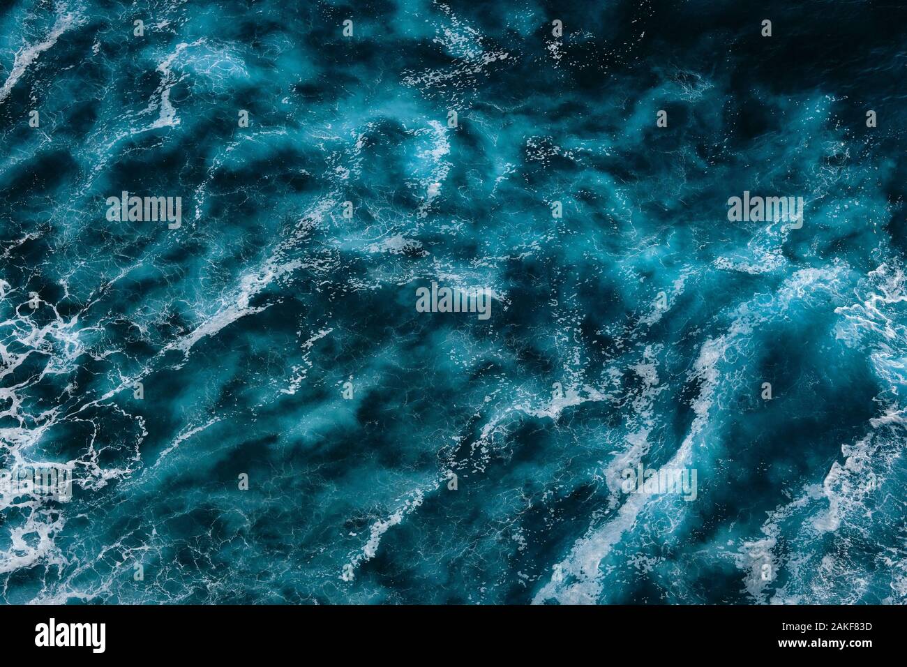 Aerial view to ocean waves. Blue water background. Dramatic colors ...