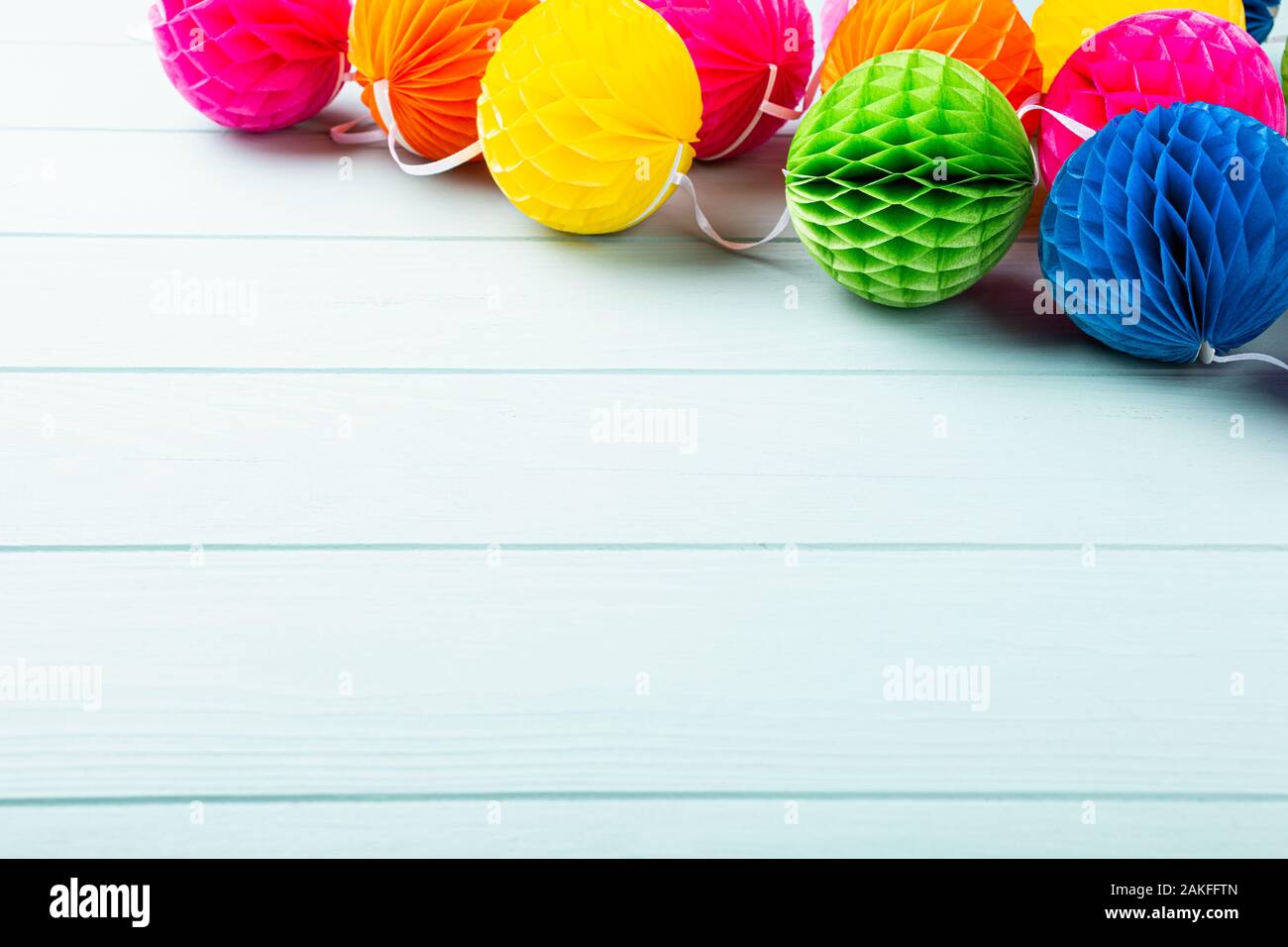 Festive background with colorful paper balls. Stock Photo