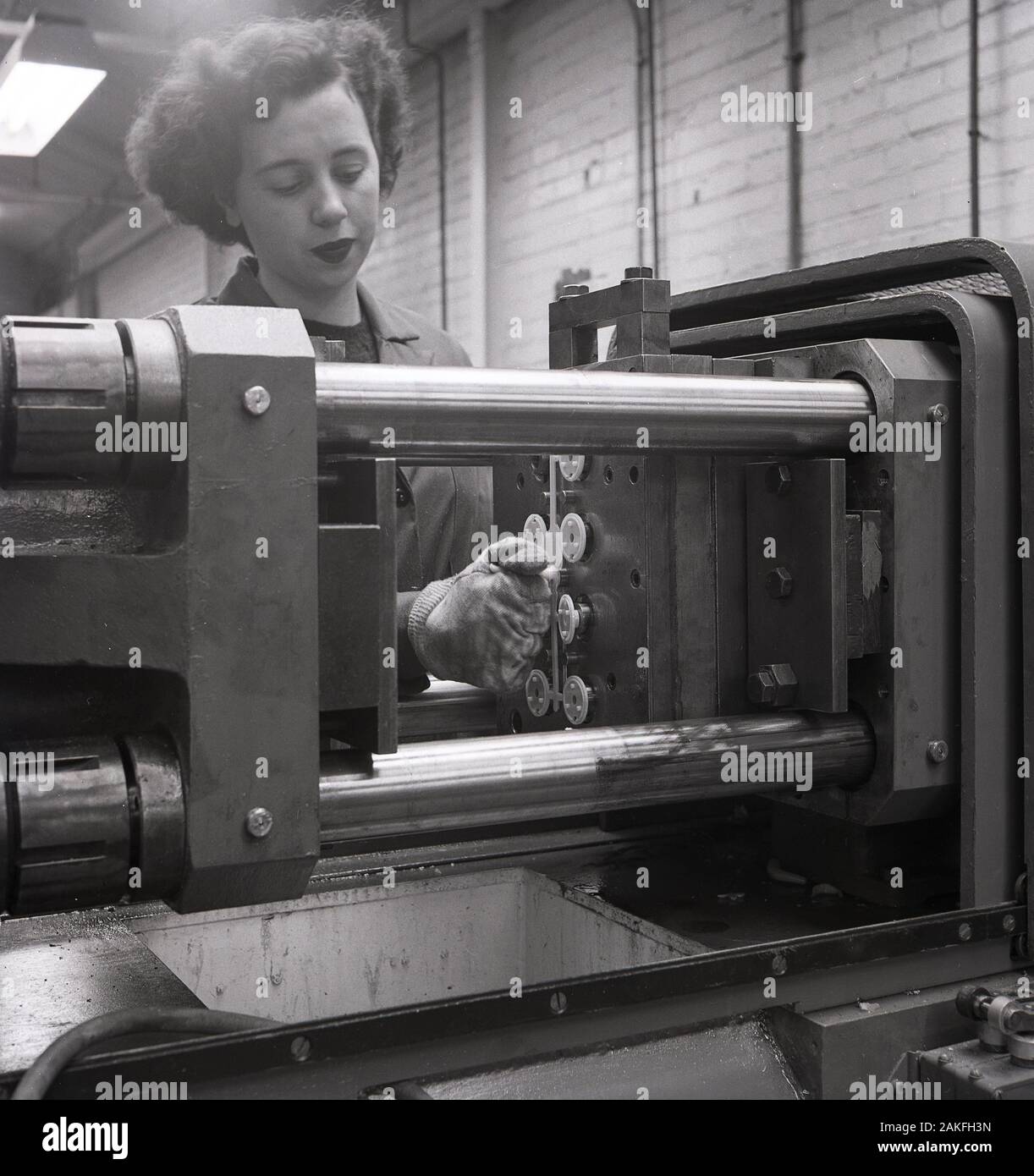 1950s, historical, female factory operative working at industrial