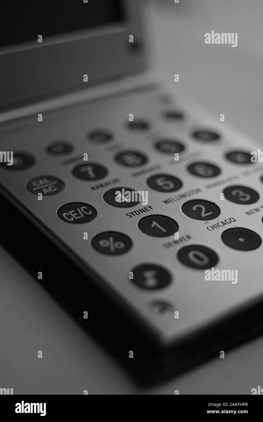 Metal calculator, close-up of buttons with numbers and names of ...