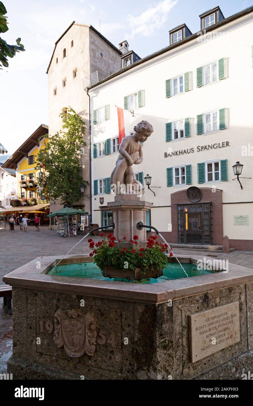 Fountain in Zell am See, Austria. The fountain has a plaque commemorating Hans Peter Steinacher and Roman Hagara, champions at the Sydney (2000) and A Stock Photo