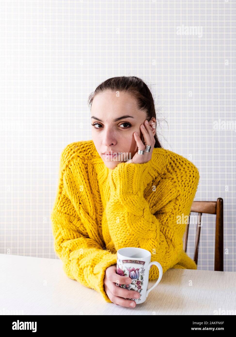 Young woman holding a cup Stock Photo