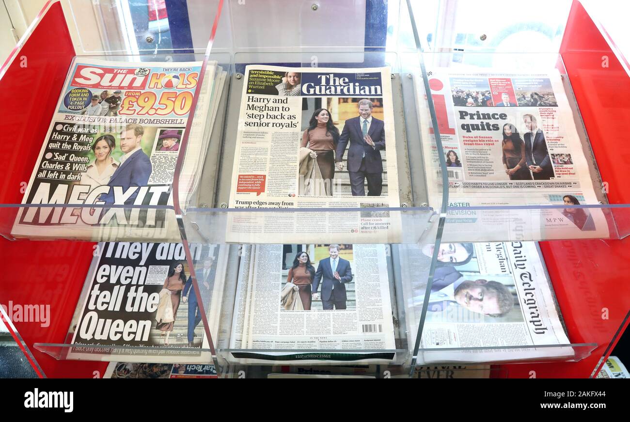 UK newspapers for sale at a newsagent in Ashford, Kent, in the wake of the announcement that the Duke and Duchess of Sussex will take a step back as 'senior members' of the royal family, dividing their time between the UK and North America. Stock Photo