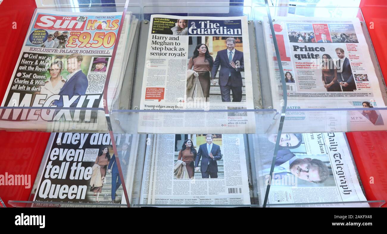 UK newspapers for sale at a newsagent in Ashford, Kent, in the wake of the announcement that the Duke and Duchess of Sussex will take a step back as 'senior members' of the royal family, dividing their time between the UK and North America. Stock Photo