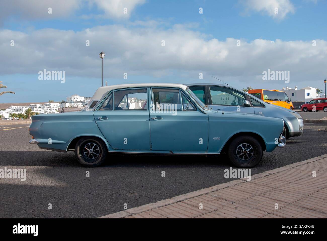 1960's Model Light Blue White Mark One Ford Cortina Motor Car right hand passengers side view of rusty lhd left hand drive four door 4 door ford corti Stock Photo