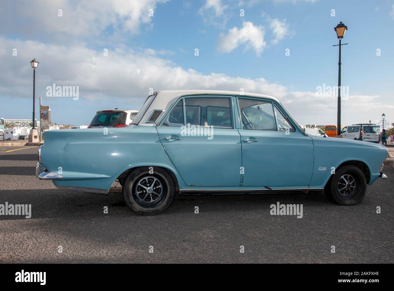 1960's Model Light Blue White Mark One Ford Cortina Motor Car right hand passengers side view of rusty lhd left hand drive four door 4 door ford corti Stock Photo