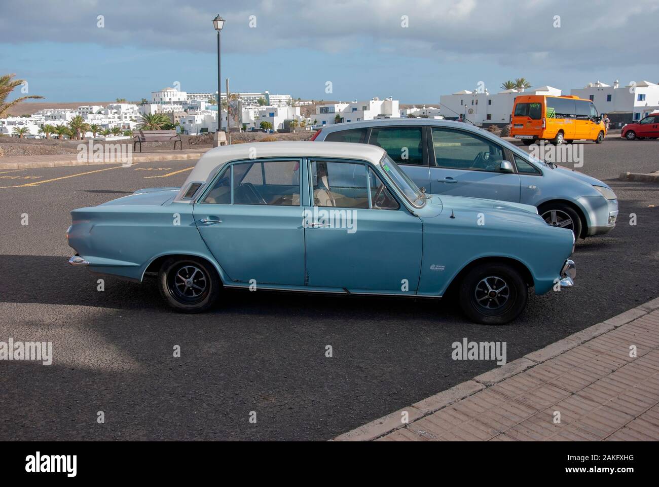 1960's Model Light Blue White Mark One Ford Cortina Motor Car right hand passengers side view of rusty lhd left hand drive four door 4 door ford corti Stock Photo