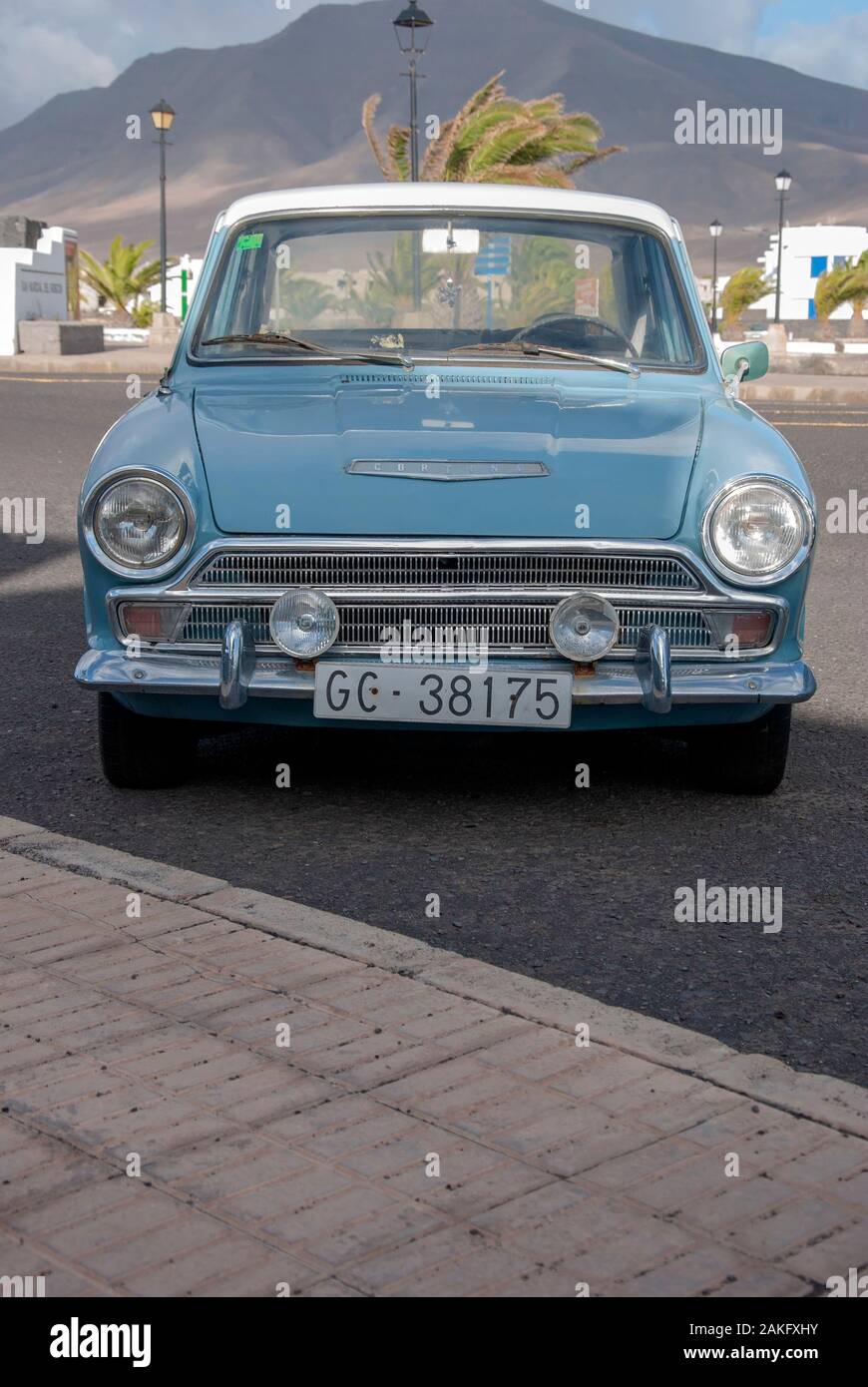 1960's Model Light Blue White Mark One Ford Cortina Motor Car front low angle view of rusty lhd left hand drive four door 4 door ford cortina mk 1 mar Stock Photo