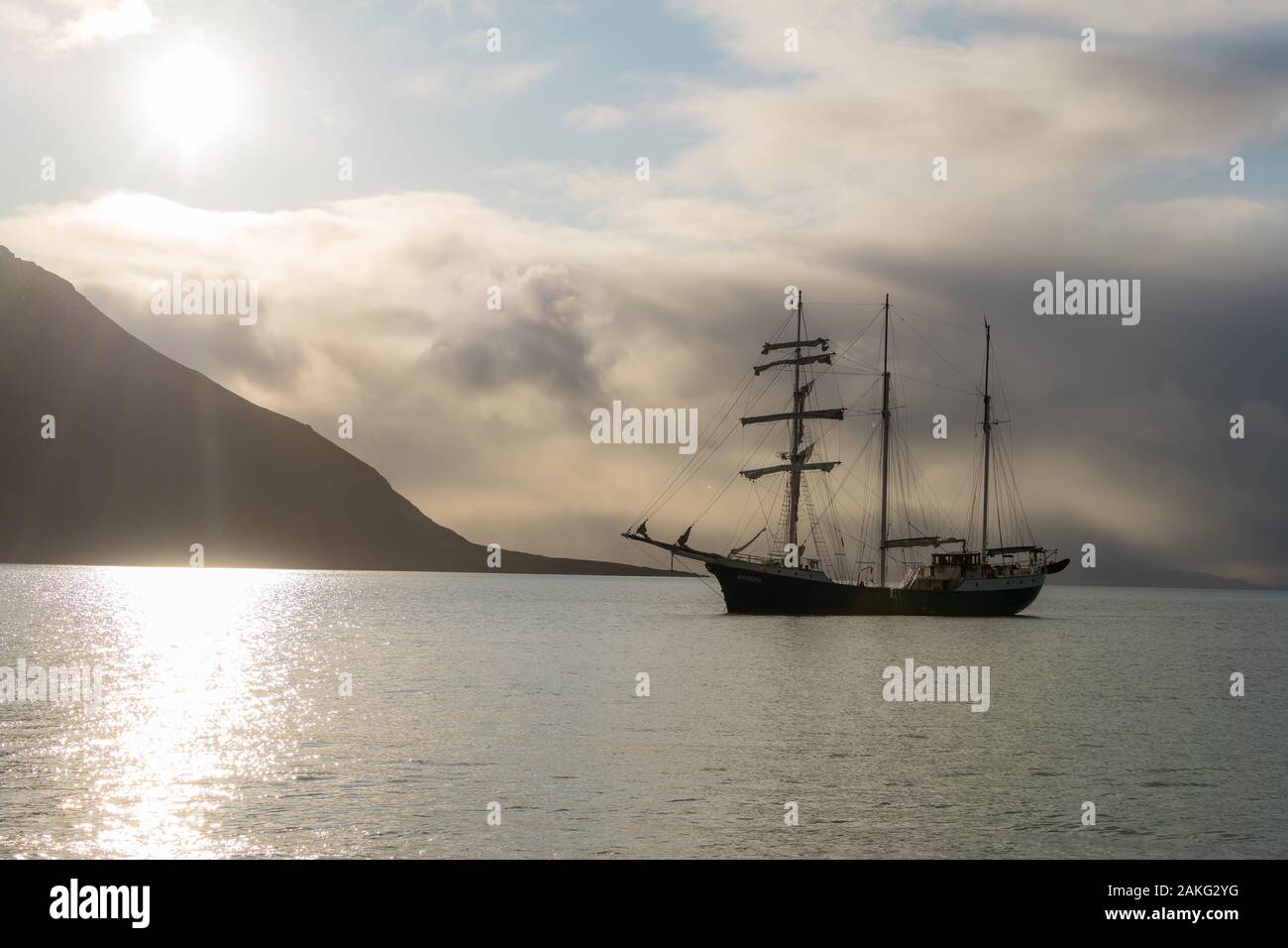 sailboat silhouette in arctic sunset light Stock Photo