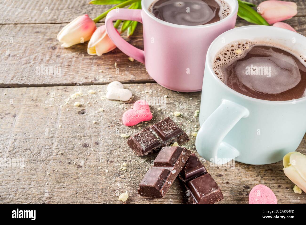 https://c8.alamy.com/comp/2AKG4FD/valentines-day-treat-ideas-two-cups-hot-chocolate-drink-with-marshmallow-hearts-red-pink-white-color-with-chocolate-pieces-sugar-sprinkles-old-wood-2AKG4FD.jpg