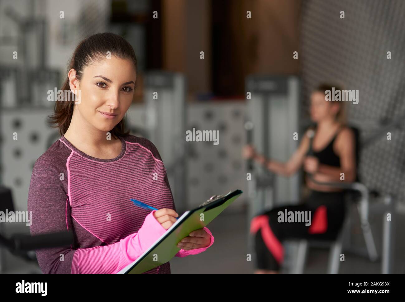 Portrait of female coach at the gym Stock Photo